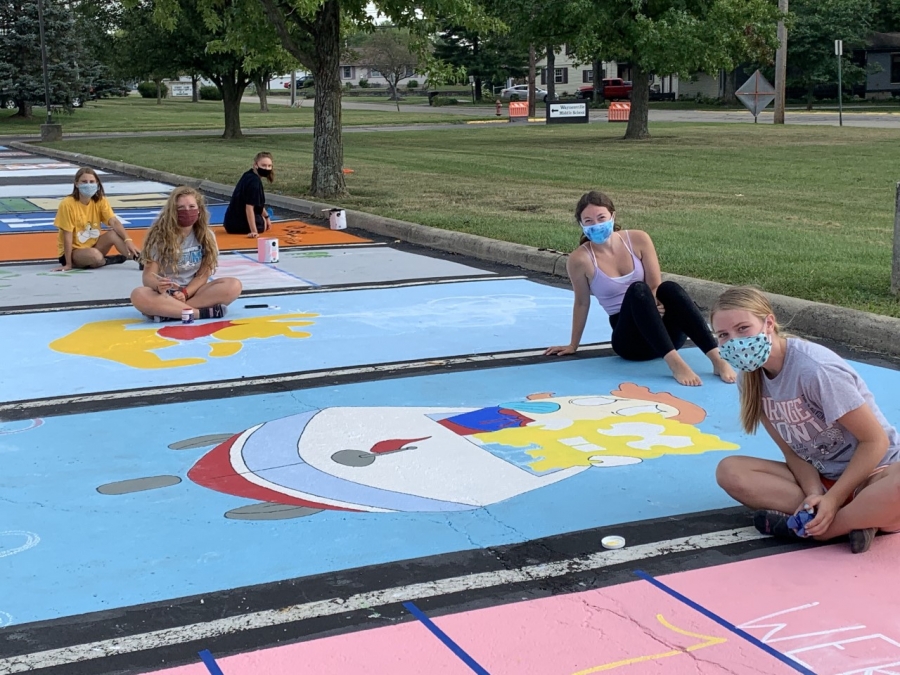 image of students painting parking spots